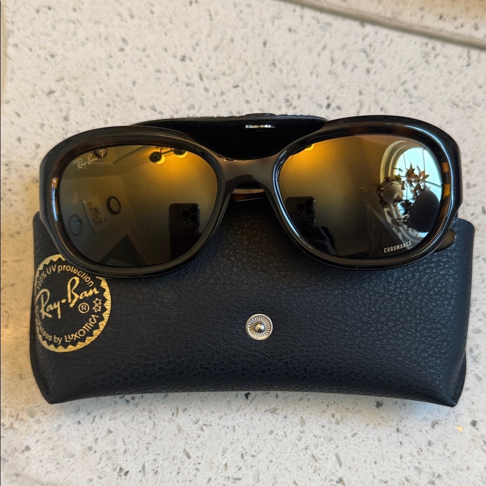 Ray-Ban Black Frames with Gold Lenses